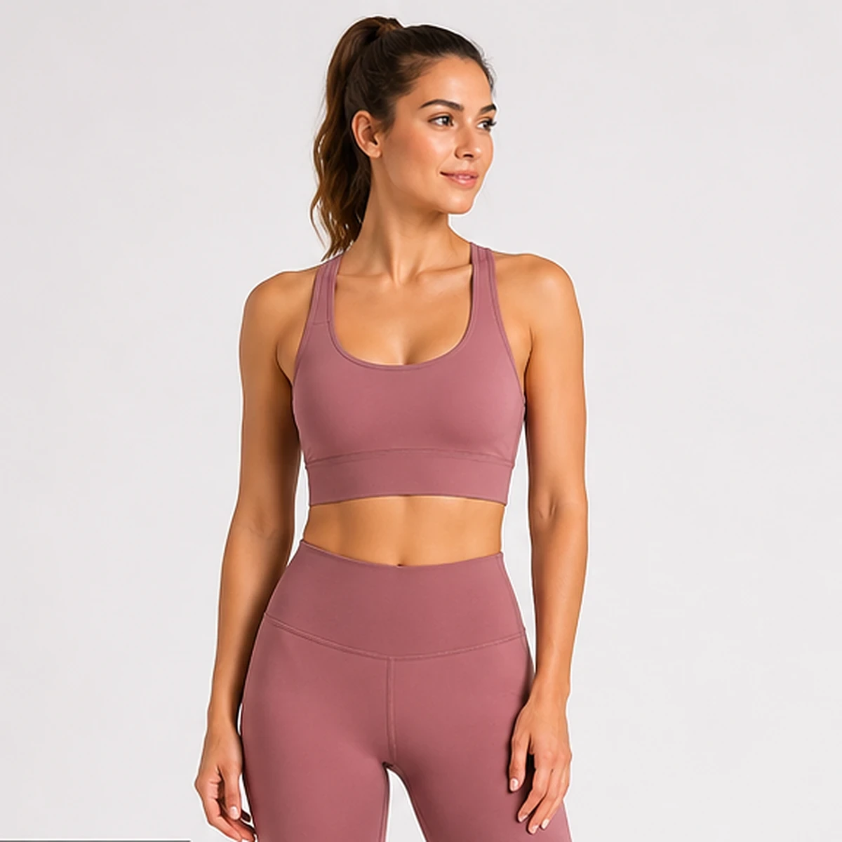 Woman wearing a mauve sports bra for support and fabric evaluation